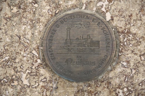 Monument to merchant, publicist and publisher Carl Joseph Meyer, with inscription Meyers Eisenwerk der deutschen Schienen-Kompagne, company, Neuhaus, round, plaque, medallion, embossing, historical locomotive, railway, company, Compagne, Meyer monument, detail, Hildburghausen, Franconia, Thuringia, Germany