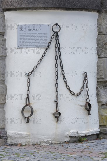 Medieval pillory with chains and rings, shackles, metal fittings, fittings, inscription, text, town hall, market square, Ilmenau, Thuringian Forest, Thuringia, Germany