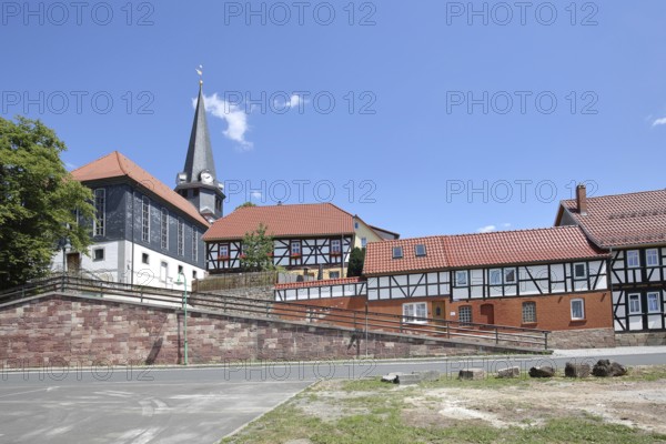 St. Johannes Church, with half-timbered houses, stone wall, Viernau, Steinbach-Hallenberg, Thuringian Forest, Thuringia, Germany