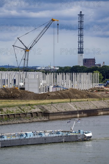 Construction of a new logistics hall on the Mercatroinsel, Hall 2, next to an existing hall, approx. 25, 000 square metres in size, in Duisburg-Ruhrort, shell construction, tanker on the Rhine, North Rhine-Westphalia, Germany
