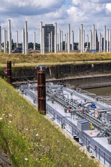 Construction of a new logistics hall on the Mercatroinsel, Hall 2, next to an existing hall, approx. 25, 000 square metres in size, in Duisburg-Ruhrort, shell construction, tanker in the Vinckekanal, North Rhine-Westphalia, Germany