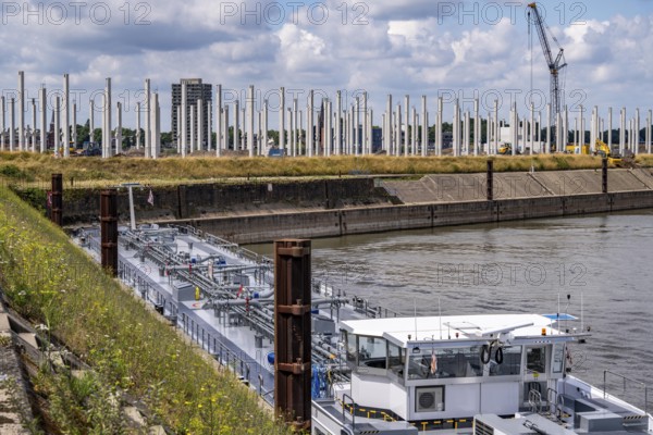 Construction of a new logistics hall on the Mercatroinsel, Hall 2, next to an existing hall, approx. 25, 000 square metres in size, in Duisburg-Ruhrort, shell construction, tanker in the Vinckekanal, North Rhine-Westphalia, Germany