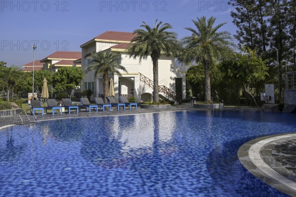 Swimming pool of the Resort De Coração, near Ramnagar, Corbett National Park, Uttarakhand State, India