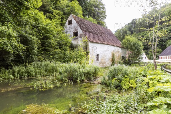 Old barn. The building is located near the source of the Zwiefalter Ach river at the Wimsen Cave excursion destination in the Swabian Alb. Hayingen, Baden-Württemberg, Germany