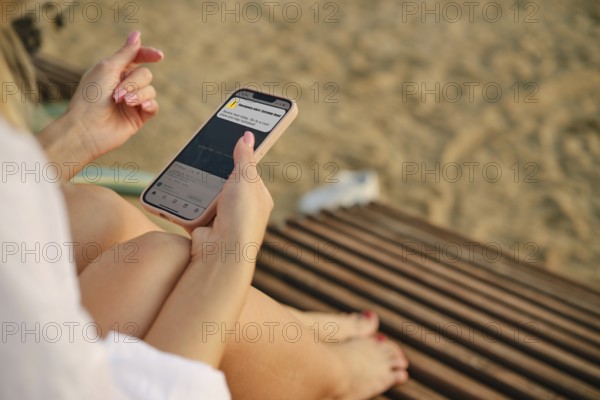 Unrecognizable woman got an emergency alert message on her smartphone