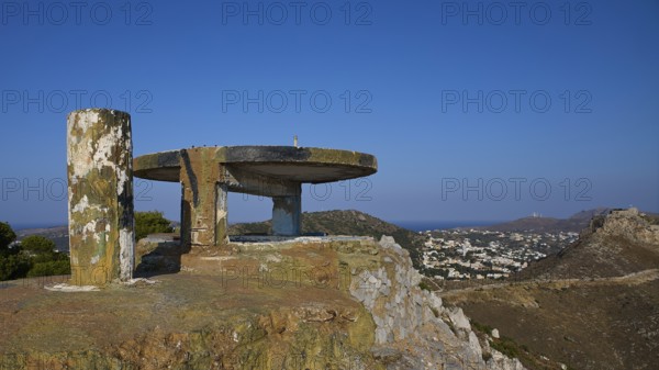 An abandoned concrete structure on a hill with a sweeping view over a cityscape, Lost Place, Lago anti-aircraft battery, bunker, Apitiki Mountain, Leros, Dodecanese, Greek Islands, Greece