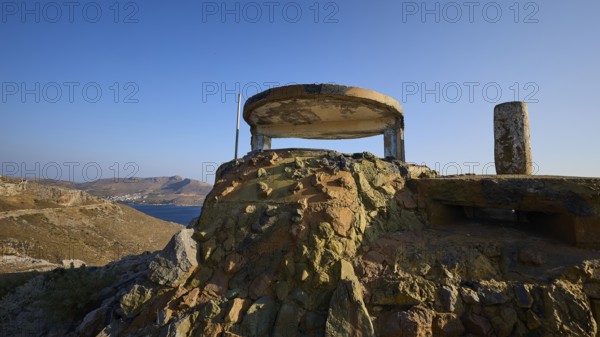 Derelict bunker structure on a hill with sea and mountains in the background, Lost Place, Lago anti-aircraft battery, bunker, Apitiki Mountain, Leros, Dodecanese, Greek Islands, Greece