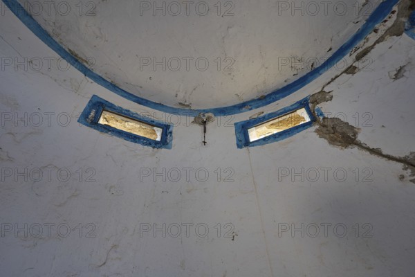 Interior of an abandoned dome with blue window frames and peeling plaster, Lost Place, Lago anti-aircraft battery, bunker, Apitiki Mountain, Leros, Dodecanese, Greek Islands, Greece