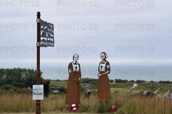 Nurse Mollie Evershed and Dorothy Field, installation, sign Gold Beach, Standing with Giants, honours the sacrifices of the fallen British soldiers by personification, British Normandy Memorial, war memorial, Ver-sur-Mer, D-Day, Operation Overlord, Gold Beach, Normandy, Calvados, France