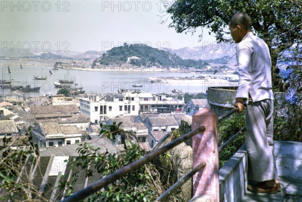 View from Monte Fort over rooftops of high density buildings in city centre, Macau, Asia 1964
