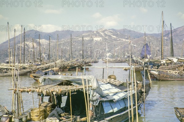 Fishing boats Chinese junks ships in harbour, Macau, Asia 1964