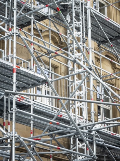 Scaffolded façade of the district court with metal platforms and stairs in Wuppertal, Germany