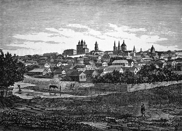 View over the meadows and the Volga towards Astrakhan, city on a hill with numerous churches and towers, pastures, horse grazing, trees, nature, people, Russia, historical illustration 1896