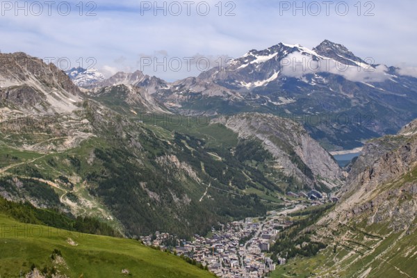 View in summer from pass road from to Col de l'Iseran to bottom of picture place winter sports resort Val d l'Isere, departmental road D902, Route des Grandes Alpes, Département Savoie, Region Auvergne-Rhône-Alpes, Graian Alps, France
