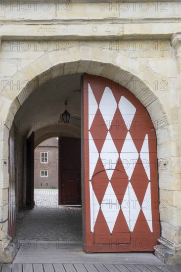 Historic moated castle, Renaissance Raesfeld Castle, façade with one Tor tor and one door, Freiheit Raesfeld, Münsterland