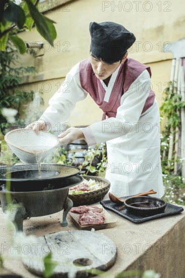 Lee Yoon Ho prepares jeongol, a traditional dish of the upper class of the Joseon dynasty Chosun Food Restoration Centre, Jeonju, Korea, 2022