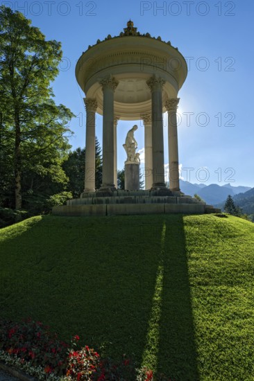 Statue of Venus with Cupid in the Temple of Venus above the terraced gardens, backlight, long shadows, blue sky, park of Linderhof Castle, UNESCO World Heritage Site, Ettal, Unterammergau, Garmisch-Partenkirchen, Upper Bavaria, Bavaria, Germany
