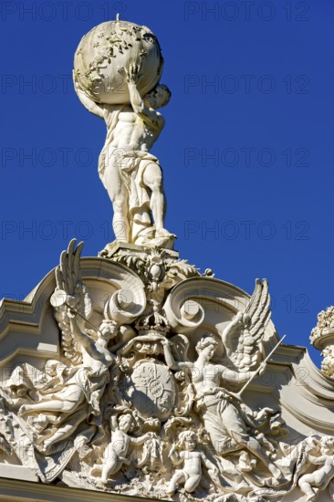 Façade with angel figures, putti around the Bavarian coat of arms, statue of Atlas with the vault of heaven, gable of Linderhof Castle, Neo Rococo, UNESCO World Heritage Site, Ettal, Unterammergau, Garmisch-Partenkirchen, Upper Bavaria, Bavaria, Germany