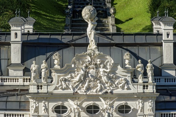 Façade with angel figures, putti around the Bavarian coat of arms, statue of Atlas with the vault of heaven, gable of Linderhof Castle, Neo Rococo, UNESCO World Heritage Site, Ettal, Unterammergau, Garmisch-Partenkirchen, Upper Bavaria, Bavaria, Germany