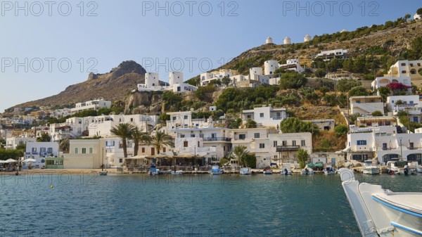 Coastal town with white houses on the hillside and a lively harbour in front of a blue sea, windmills, Pandeli Castle, castle, Leros Fortress, St John's Fortress, Apitiki Hill, Pandeli Bay, Agia Marina, Leros, Dodecanese, Greek Islands, Greece