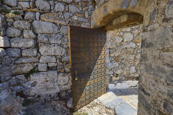 Rustic wooden gate in a stone-lined ruin, historical atmosphere, Pandeli Castle, castle, Leros Fortress, St John's Fortress, Apitiki Hill, Pandeli Bay, Agia Marina, Leros, Dodecanese, Greek Islands, Greece