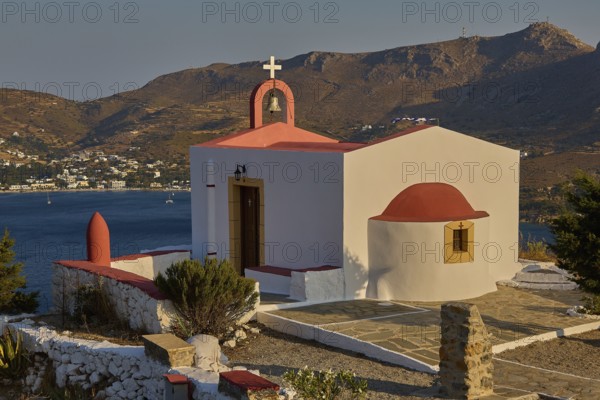 Chapel with red roof by the sea, surrounded by mountains and coastline, peaceful atmosphere, Profitis Ilias Church, Prophet Elias Church, morning light, Ormos Alintas, Agia Marina, Leros, Dodecanese, Greek Islands, Greece