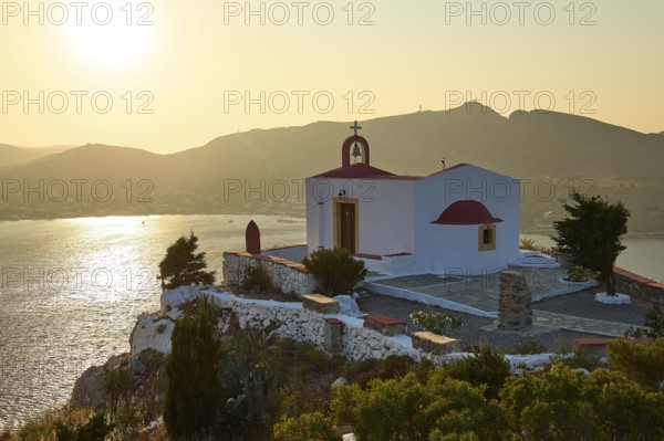Chapel on a hill overlooking the sea and the mountains at sunset, Profitis Ilias Church, Prophet Elias Church, evening light, sunset, Ormos Alintas, Agia Marina, Leros, Dodecanese, Greek Islands, Greece