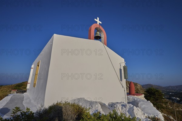 Simple chapel with bell on a hill, blue sky in the background, Profitis Ilias Church, Prophet Elias Church, evening light, sunset, Ormos Alintas, Agia Marina, Leros, Dodecanese, Greek Islands, Greece