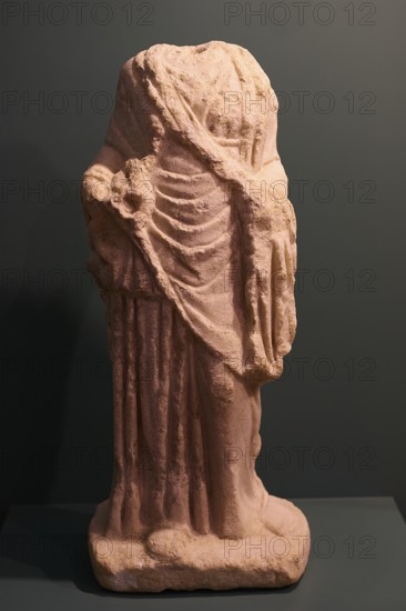 Headless ancient Roman statue fragment with draped robe made of sandstone, Archaeological Museum, Agia Marina, Leros, Dodecanese, Greek Islands, Greece