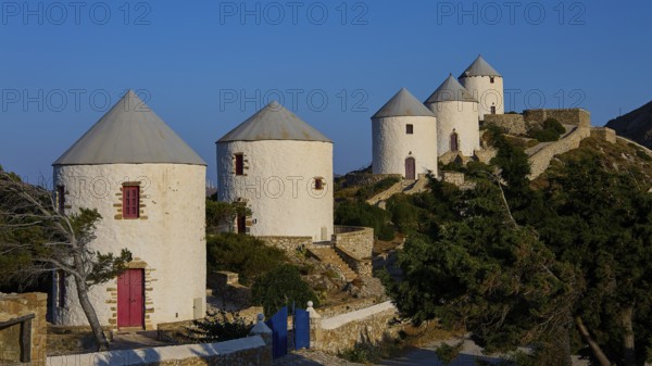 Five white windmills on a hill in front of a blue sky, Pandeli Castle, Castle, Leros Fortress, St John's Fortress, Apitiki Hill, Pandeli Bay, Windmills, Leros, Dodecanese, Greek Islands, Greece