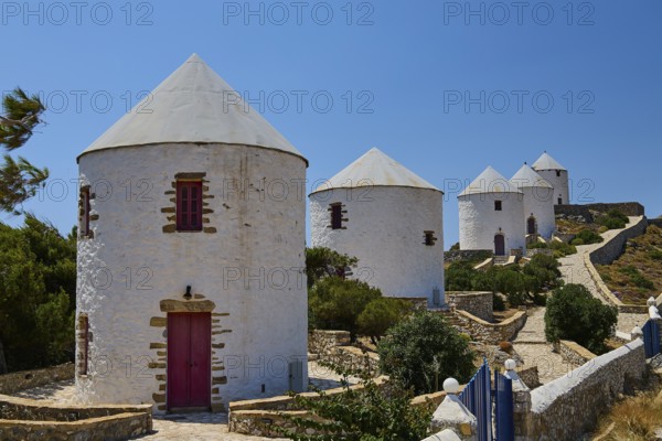 White windmills with red doors under a clear blue sky on a Greek island, Pandeli Castle, Castle, Leros Fortress, St John's Fortress, Apitiki Hill, Pandeli Bay, Windmills, Leros, Dodecanese, Greek Islands, Greece