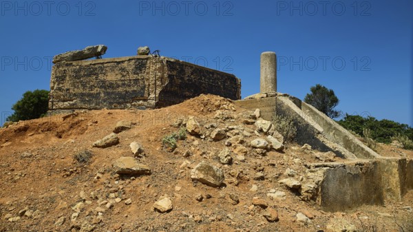 Old, crumbling structure on a desert-like terrain with rubble, Lost Place, Air Defence Position, Aerophone, Parabolic Acoustic Mirror, Patella Mountain, WW2, west of Lakki, Leros, Dodecanese, Greek Islands, Greece