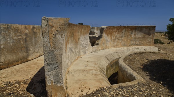 Abandoned concrete ruins under a clear sky, Lost Place, Air Defence Position, Aerophone, Parabolic Acoustic Mirror, Patella Mountain, WW2, west of Lakki, Leros, Dodecanese, Greek Islands, Greece