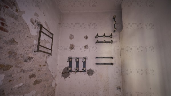 Lost Place, An empty white room with remains of pipes on the walls, electrical installations, Radio Station, WW2, Agios Nikolaos Radio, Agia Marina, Leros, Dodecanese, Greek Islands, Greece