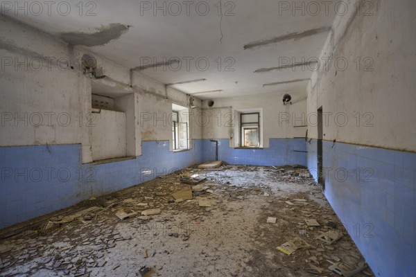 Lost Place, Abandoned room covered with rubble, blue wall plaster and damaged ceiling visible, Radio Station, WW2, Agios Nikolaos Radio, Agia Marina, Leros, Dodecanese, Greek Islands, Greece