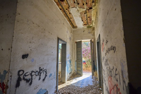 Lost Place, Abandoned hallway with graffiti and open doors, Flooded with light in a dilapidated state, Radio Station, WW2, Agios Nikolaos Radio, Agia Marina, Leros, Dodecanese, Greek Islands, Greece