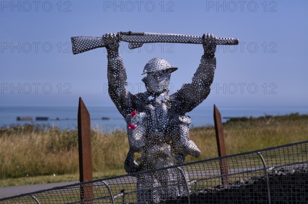 Sculpture by Bill Pendell MM, British World War II veteran, looking back at himself and his comrades in the Battle of Gold Beach, D-Day 75 garden, also Le Jardin du Souvenir, D-Day, Operation Overlord, Mulberry B, Mulberry Harbour, Gold Beach, beach, Port Winston, Arromanches-les-Bains, Normandy, Calvados, France