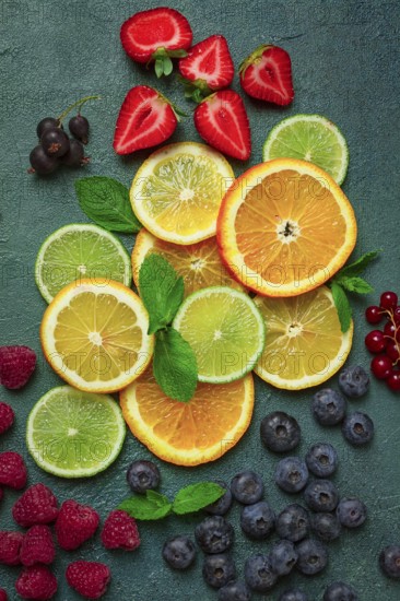 Mix of fruits and berries, set, assortment, sliced citrus fruits, raspberries, blueberries, mint leaves, strawberries, red currants, food background, fruit wallpaper