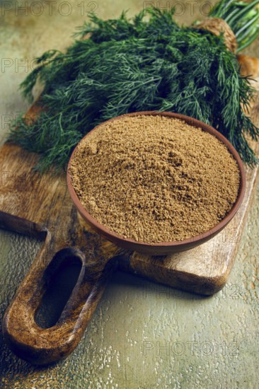 Dried dill, in a ceramic bowl, a bunch of fresh dill, seasoning, top view, no people