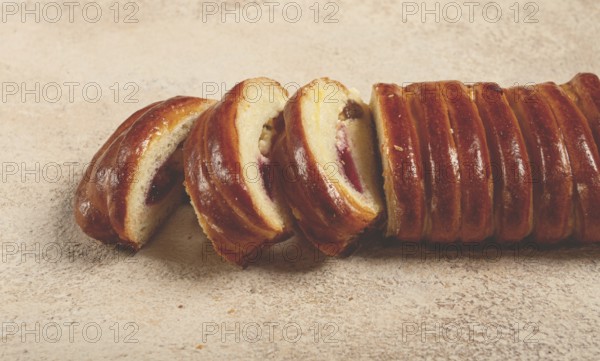 Sweet braided roll, stuffed with jam and raisins, pastries, sweet bread with filling, sweet pie, no people