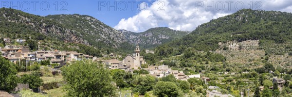 Valldemossa village on Majorca with church holiday at the Serra de Tramuntana travel panorama in Valldemossa, Spain