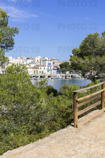 Portocolom fishing village on Majorca with boats and colourful houses Holiday by the sea in Portocolom, Spain