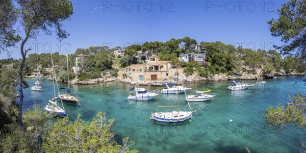 Bay of Cala Figuera on Majorca with boats panoramic holiday by the sea trip in Cala Figuera, Spain