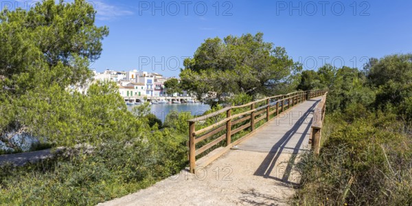 Portocolom fishing village on Majorca with boats and colourful houses Holiday by the sea Panorama trip in Portocolom, Spain