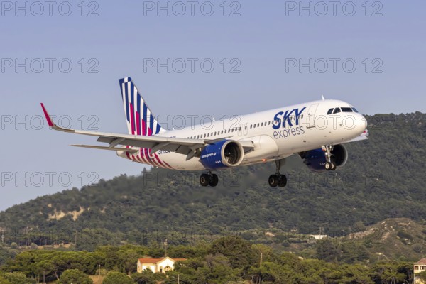 An Airbus A320neo aircraft of SKY Express with the registration SX-GNA at Rhodes Airport, Greece
