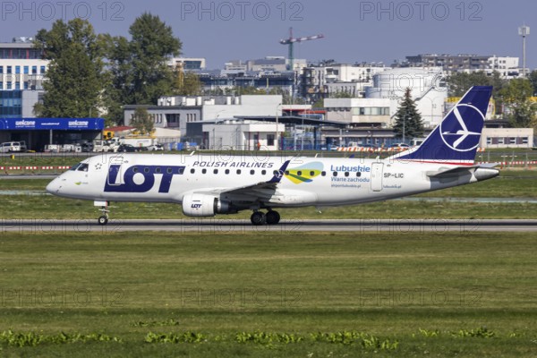 An Embraer 175 aircraft of LOT Polish Airlines with the licence plate SP-LIC and a Lubuskie sticker at the airport in Warsaw, Poland