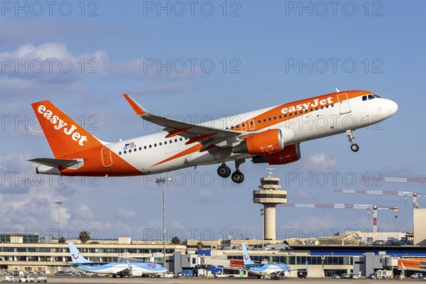 An EasyJet Europe Airbus A320 aircraft with the registration number OE-IZH at Palma de Majorca Airport, Spain