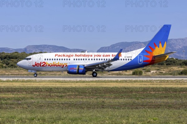 A Boeing 737-300 Jet2 aircraft with the registration G-GDFM at Palma de Majorca Airport, Spain