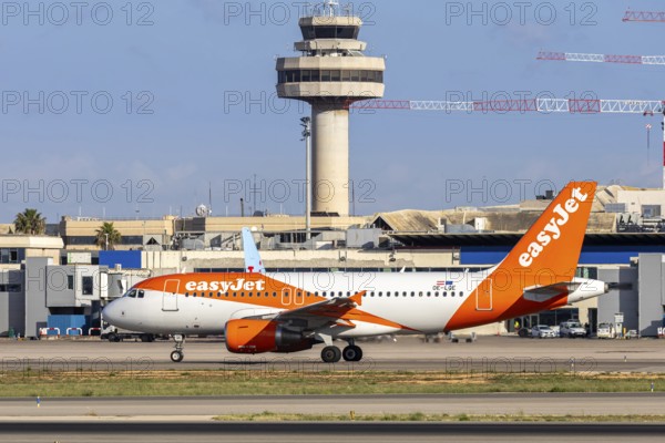 An EasyJet Europe Airbus A319 aircraft with the registration number OE-LQE at Palma de Majorca Airport, Spain