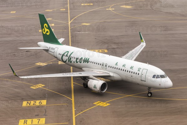A Spring Airlines Airbus A320 aircraft with the registration B-300X at Chek Lap Kok Airport (HKG) in Hong Kong, China